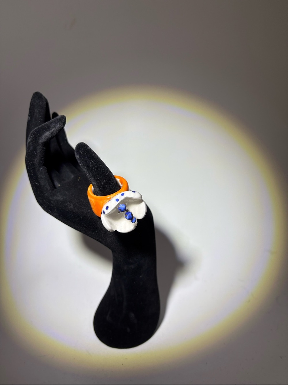 Orange Resin Ring with White Flower and Blue Accents